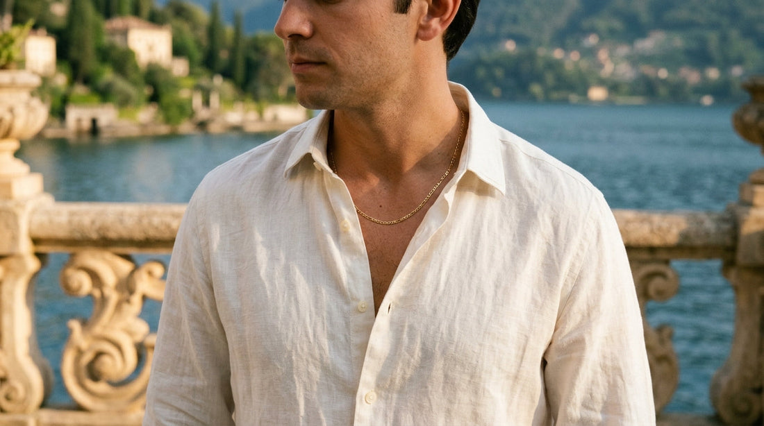 3mm figaro chain resting perfectly on a mans collarbone above Lake Como