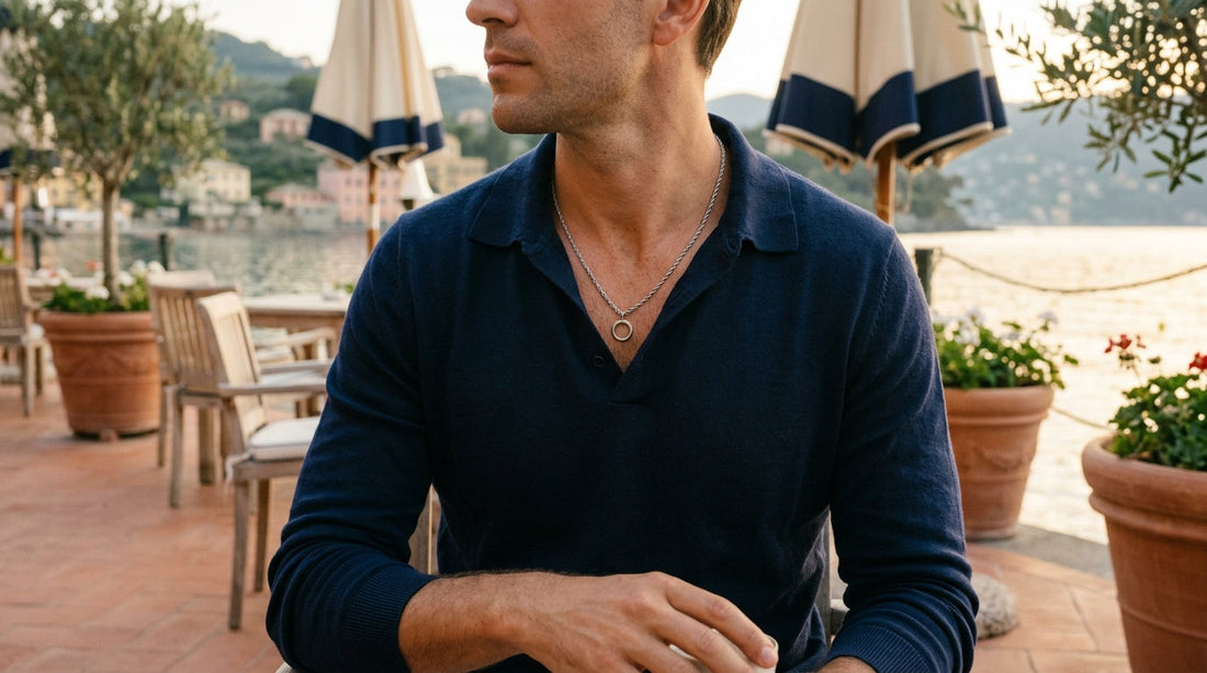 3mm steel rope chain worn over a navy polo shirt on a coastal terrace