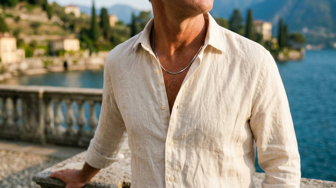 3mm steel flat snake chain worn with an open ivory linen shirt above Lake Como