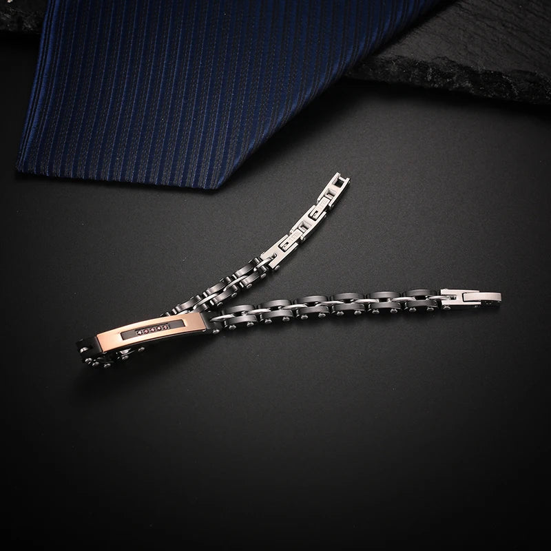 Men's two-tone rose gold and black ceramic link bracelet with red zircon accents