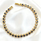 Gold with Dark Blue Zircon