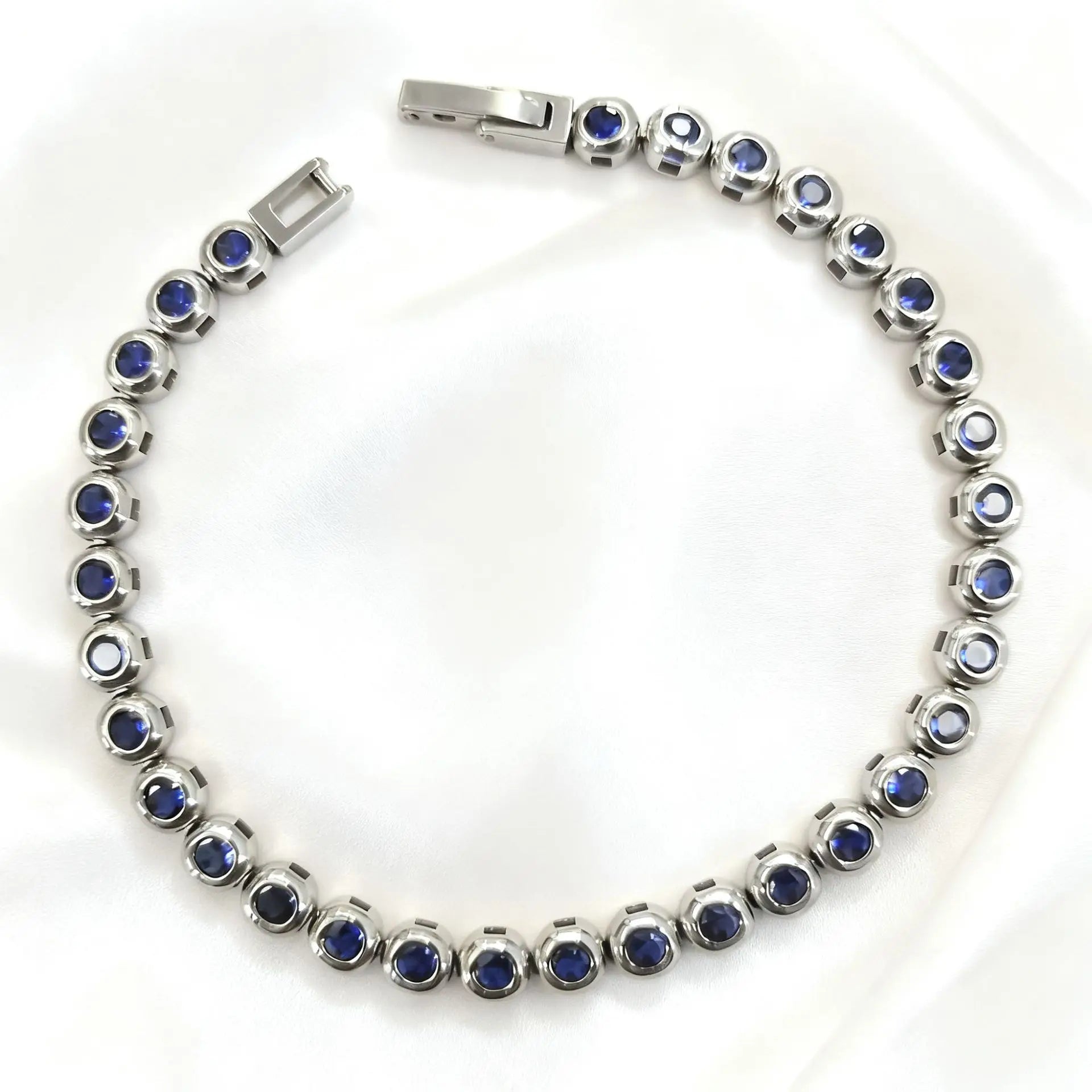 Silver with Dark Blue Zircon