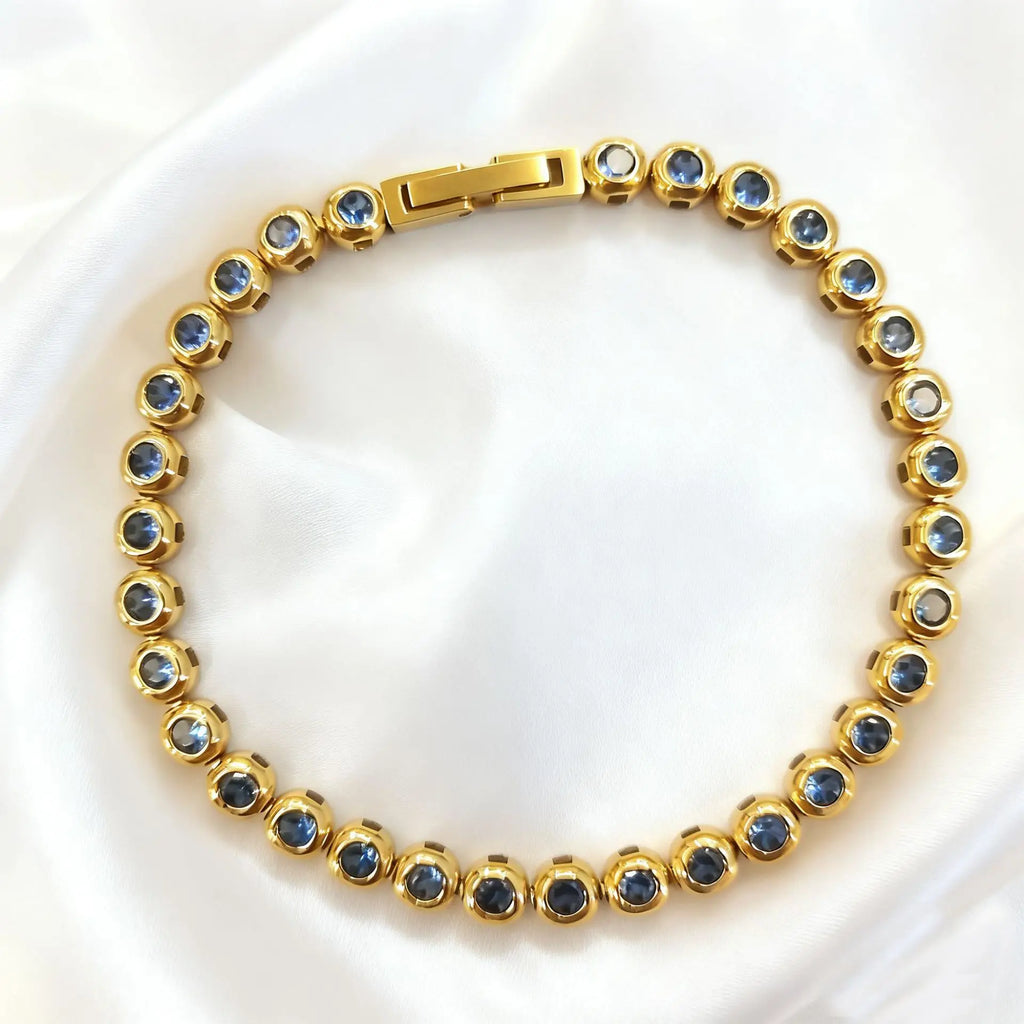 Gold with Light Blue Zircon