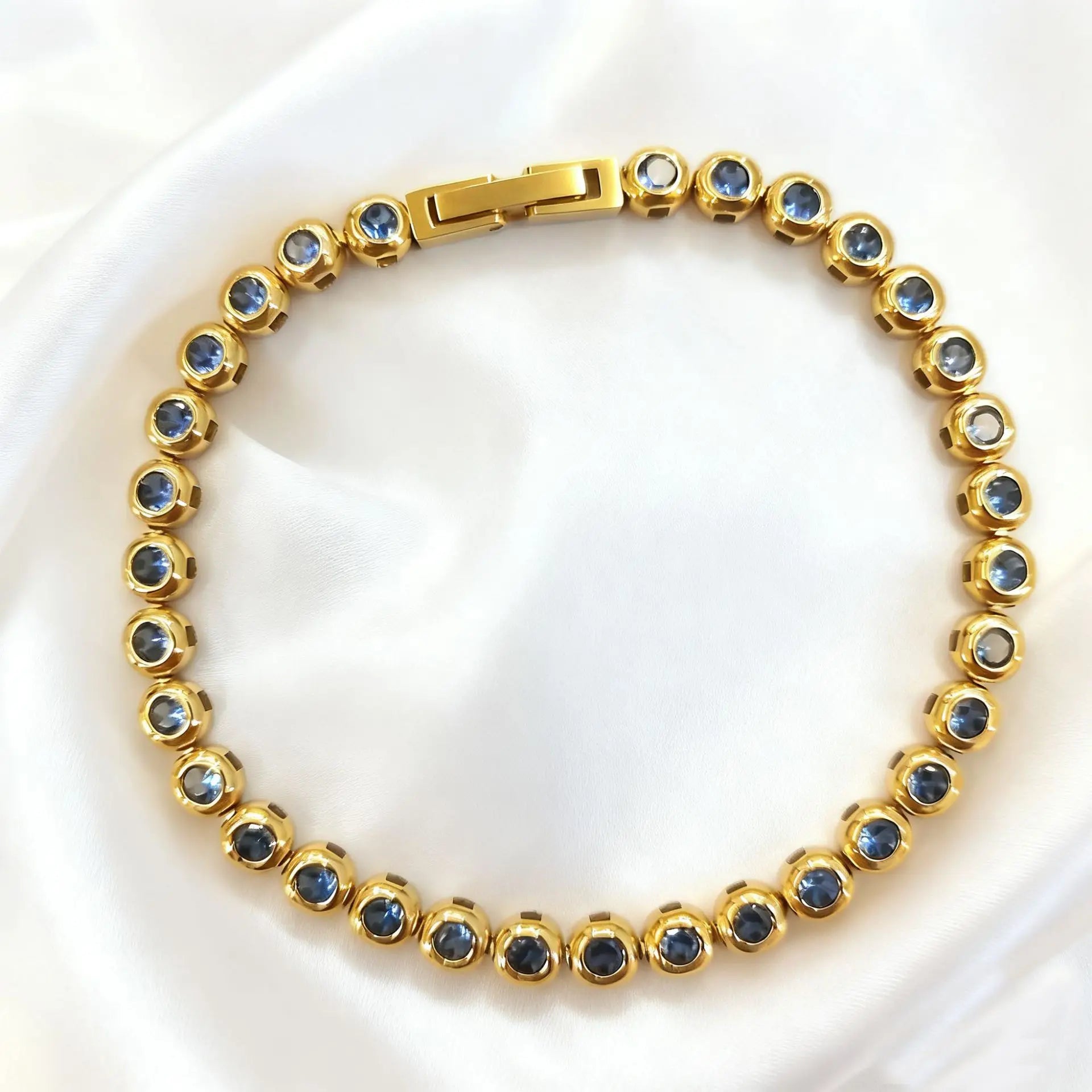 Gold with Light Blue Zircon