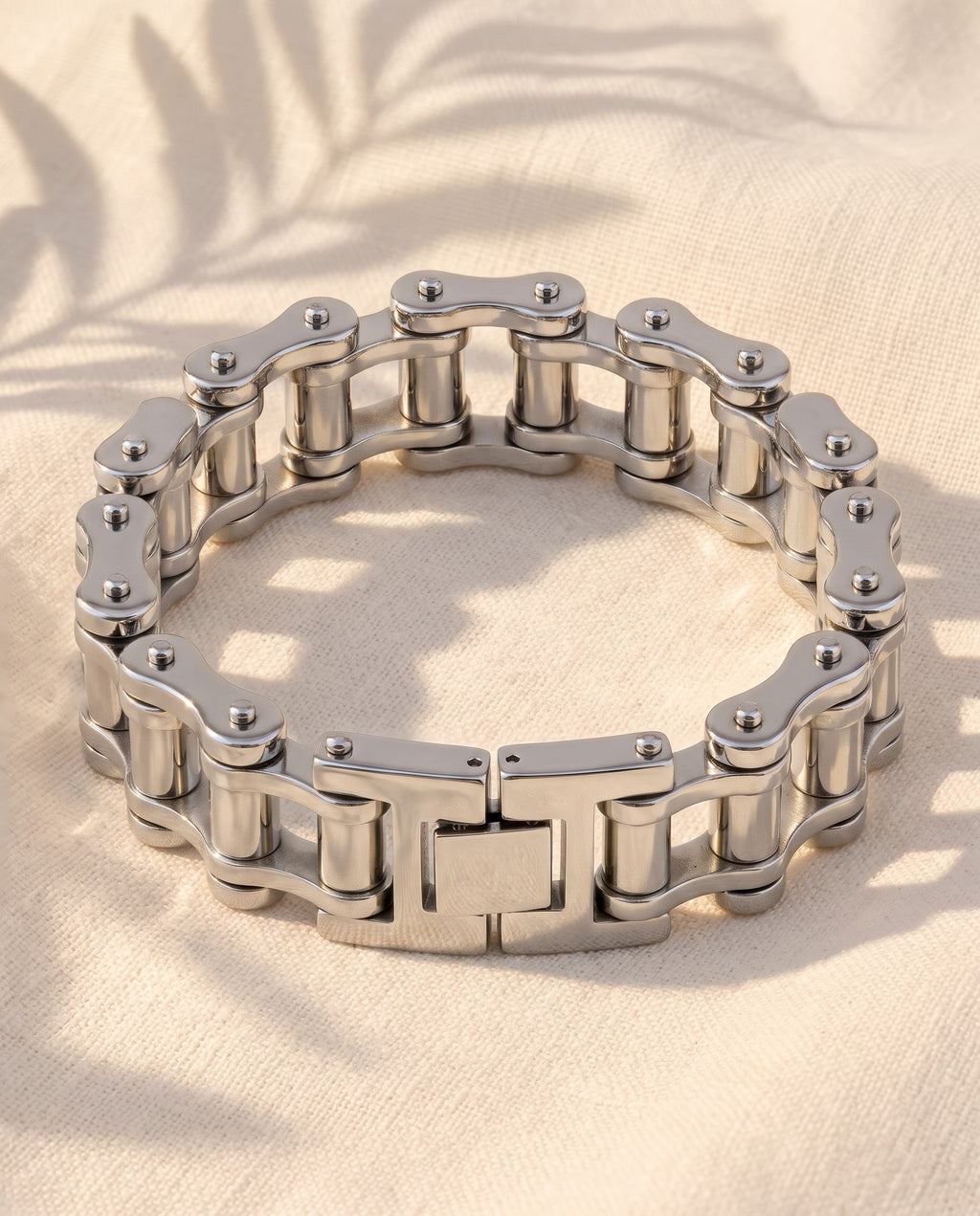 Marco Maveri Bicycle Chain Link Bracelet laid on cream linen, Silver