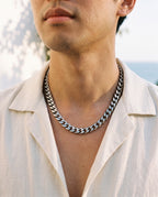 Marco Maveri Bold Cuban Link Chain in Titanium Steel worn with a linen shirt, close-up, Silver