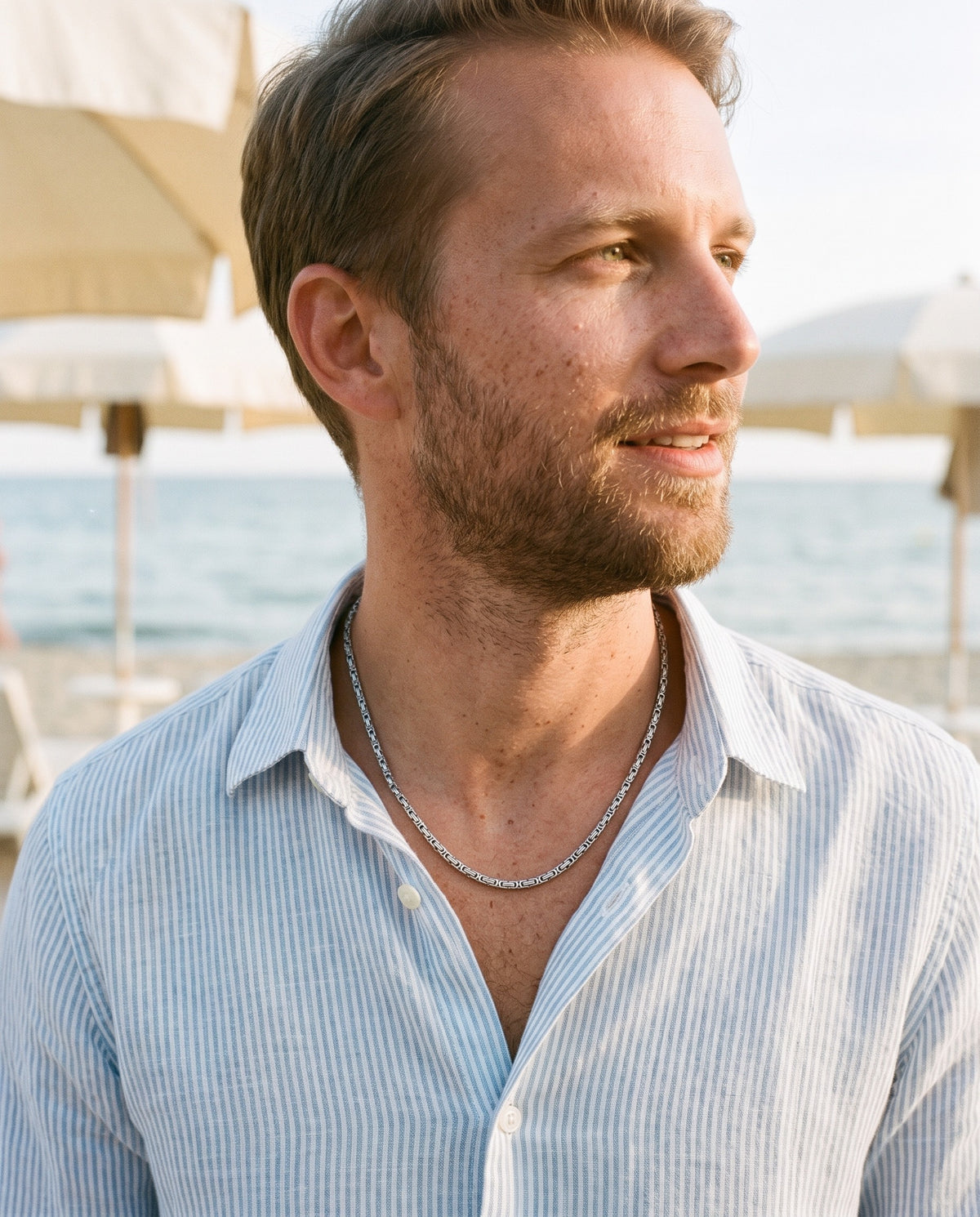 Man wearing the Marco Maveri Byzantine Chain in Stainless Steel by the sea, Silver