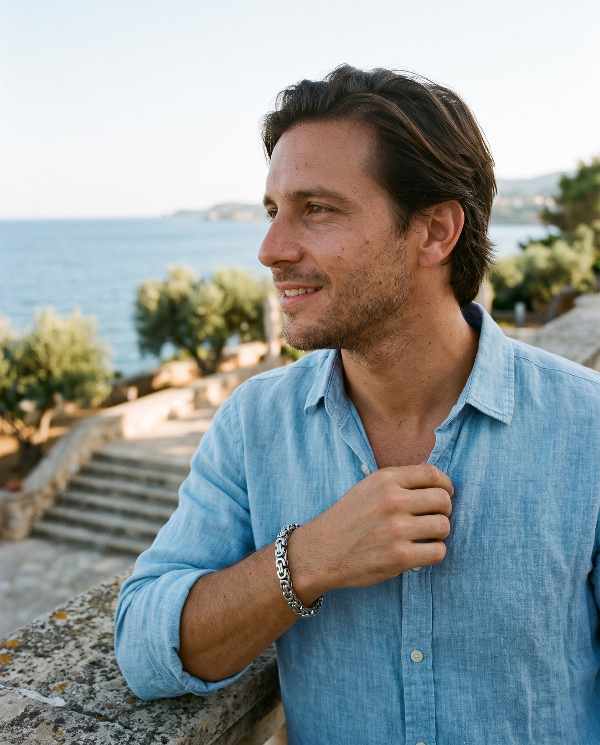 Man wearing the Marco Maveri Byzantine Link Chain Bracelet by the sea, Silver