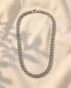 Marco Maveri Byzantine Link Chain Necklace laid on cream linen, Silver