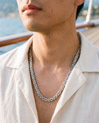Marco Maveri Byzantine Link Chain Necklace worn with a linen shirt, close-up, Silver