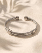 Marco Maveri Cable Cuff Bracelet laid on cream linen, Silver