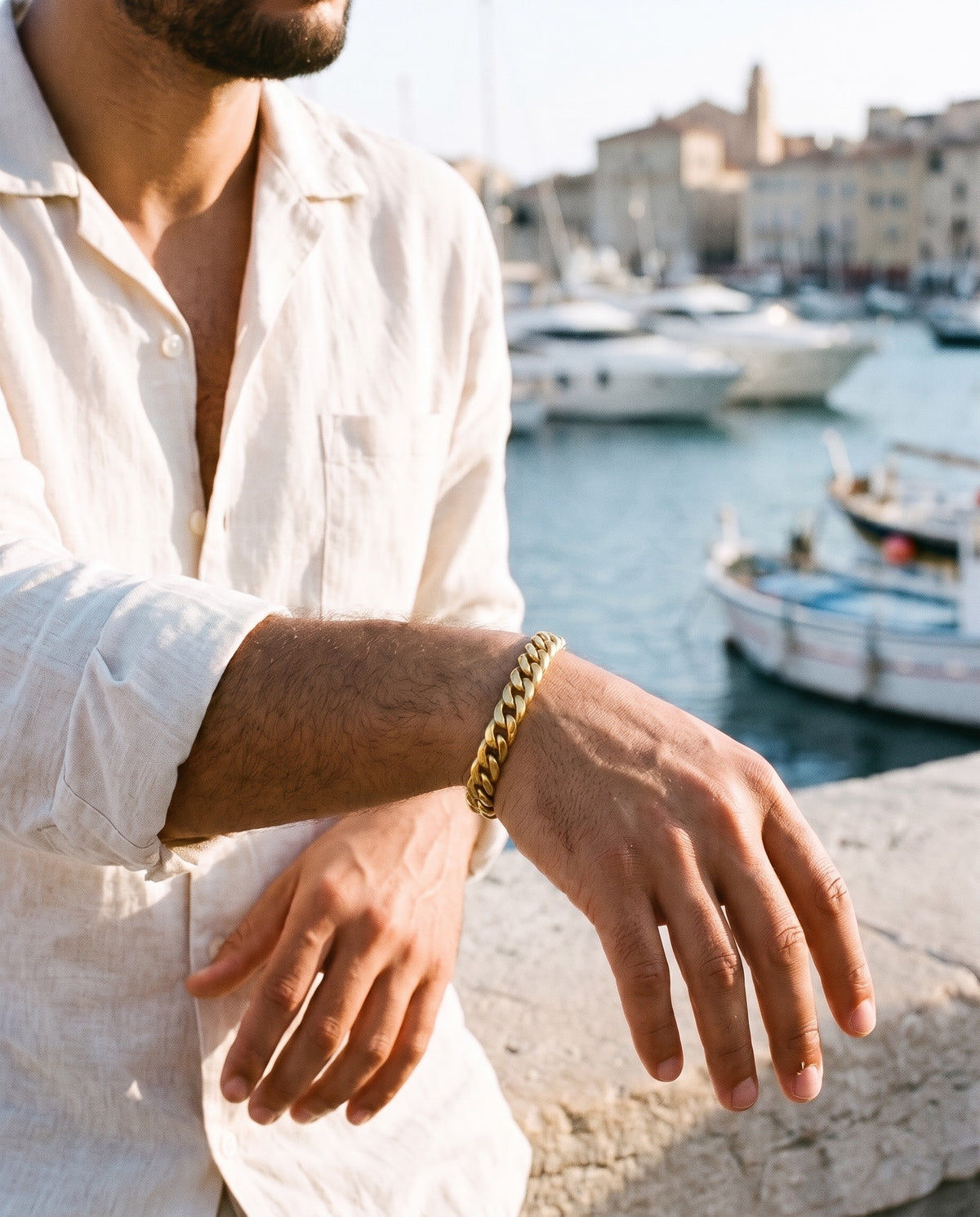 Marco Maveri Chunky Curb Link Bracelet worn with a linen shirt, close-up, Gold