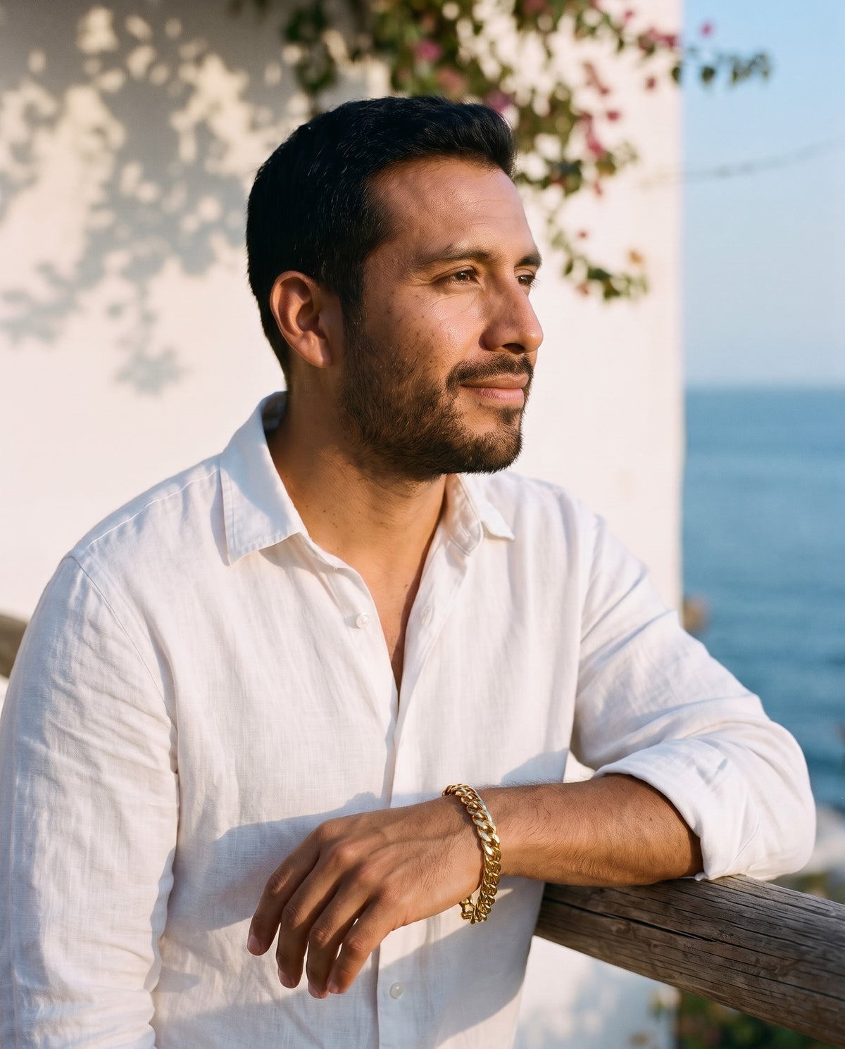 Man wearing the Marco Maveri Chunky Curb Link Bracelet by the sea, Gold