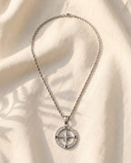 Marco Maveri Compass Pendant Rope Chain Necklace laid on cream linen, Silver