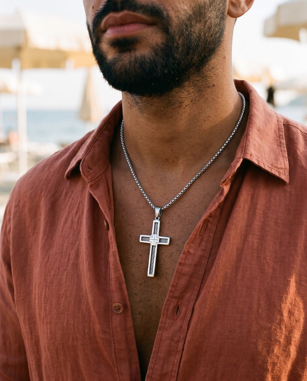 Marco Maveri Cross Pendant Necklace with Cable Inlay worn with a linen shirt, close-up, Silver