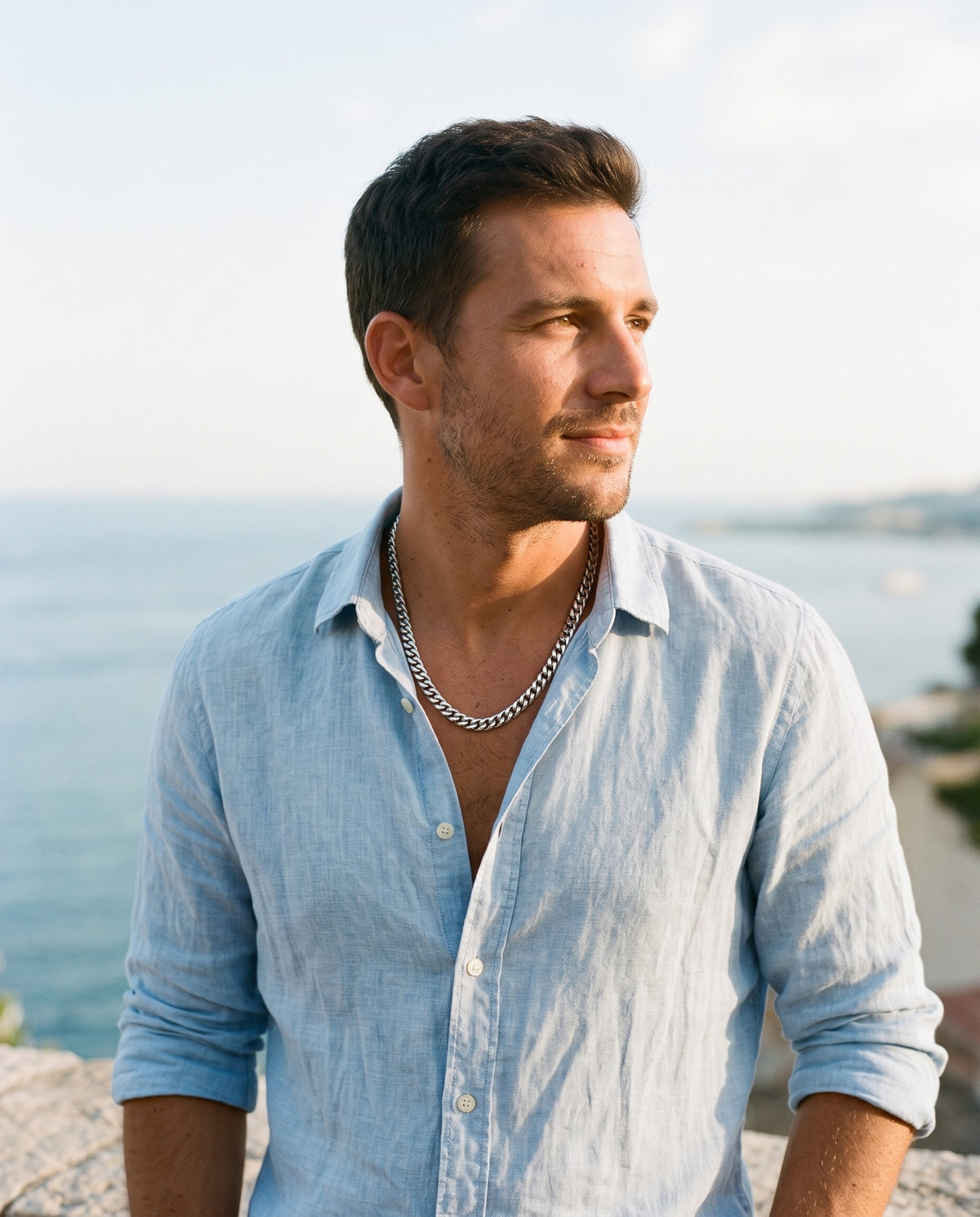 Man wearing the Marco Maveri Silver Cuban Link Chain by the sea, Silver