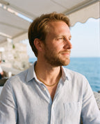 Man wearing the Marco Maveri Cuban Link Chain Necklace by the sea, Gold