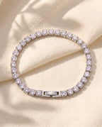 Marco Maveri Cubic Zirconia Tennis Bracelet laid on cream linen, Silver
