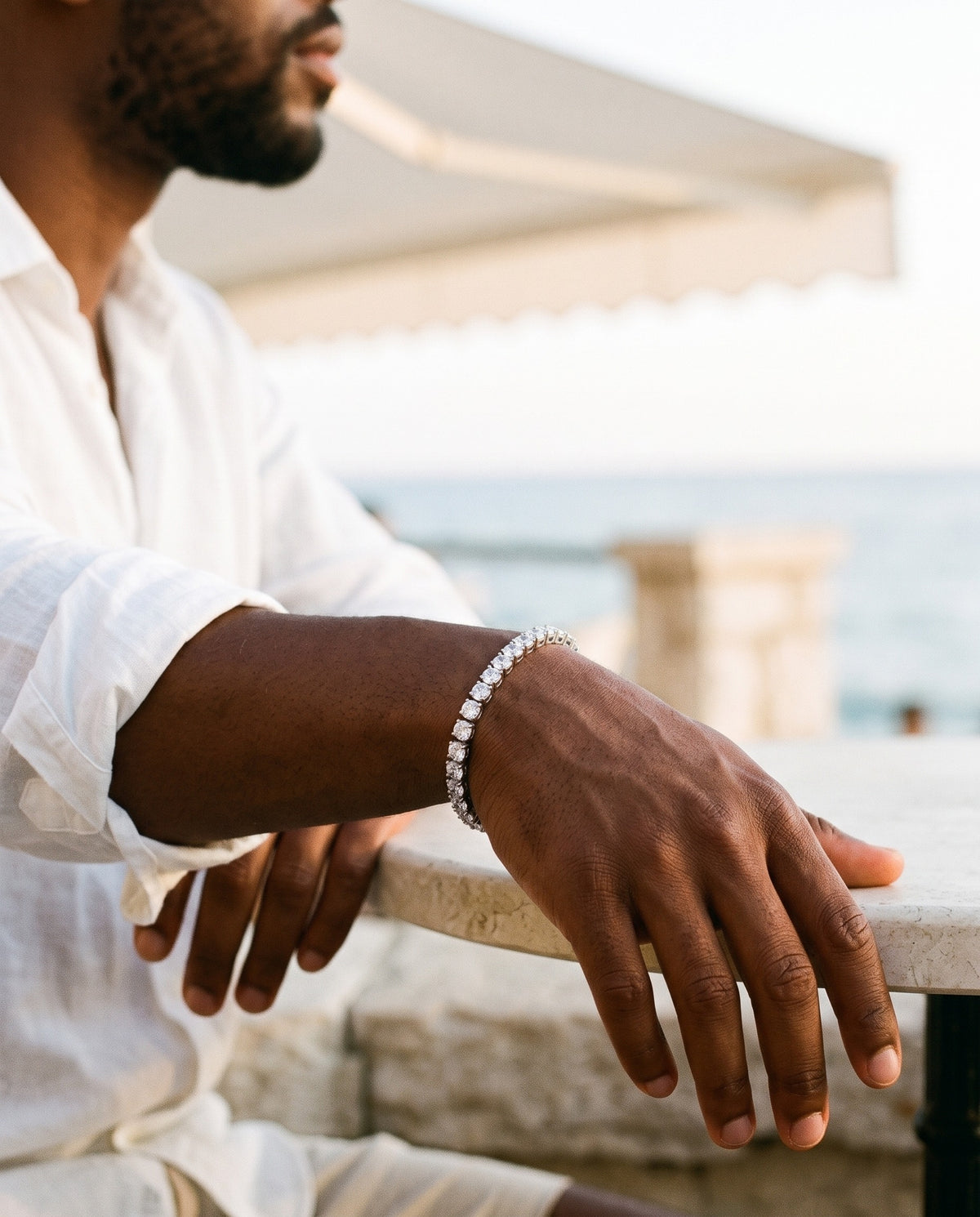 Marco Maveri Cubic Zirconia Tennis Bracelet worn with a linen shirt, close-up, Silver