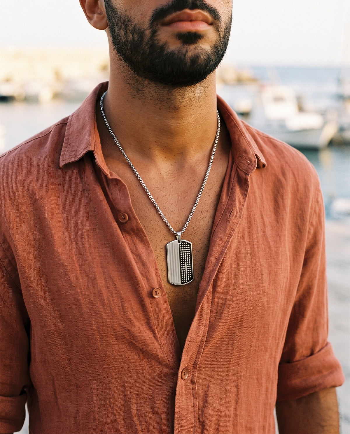 Marco Maveri Dog Tag Cross Pendant Necklace worn with a linen shirt, close-up, Silver