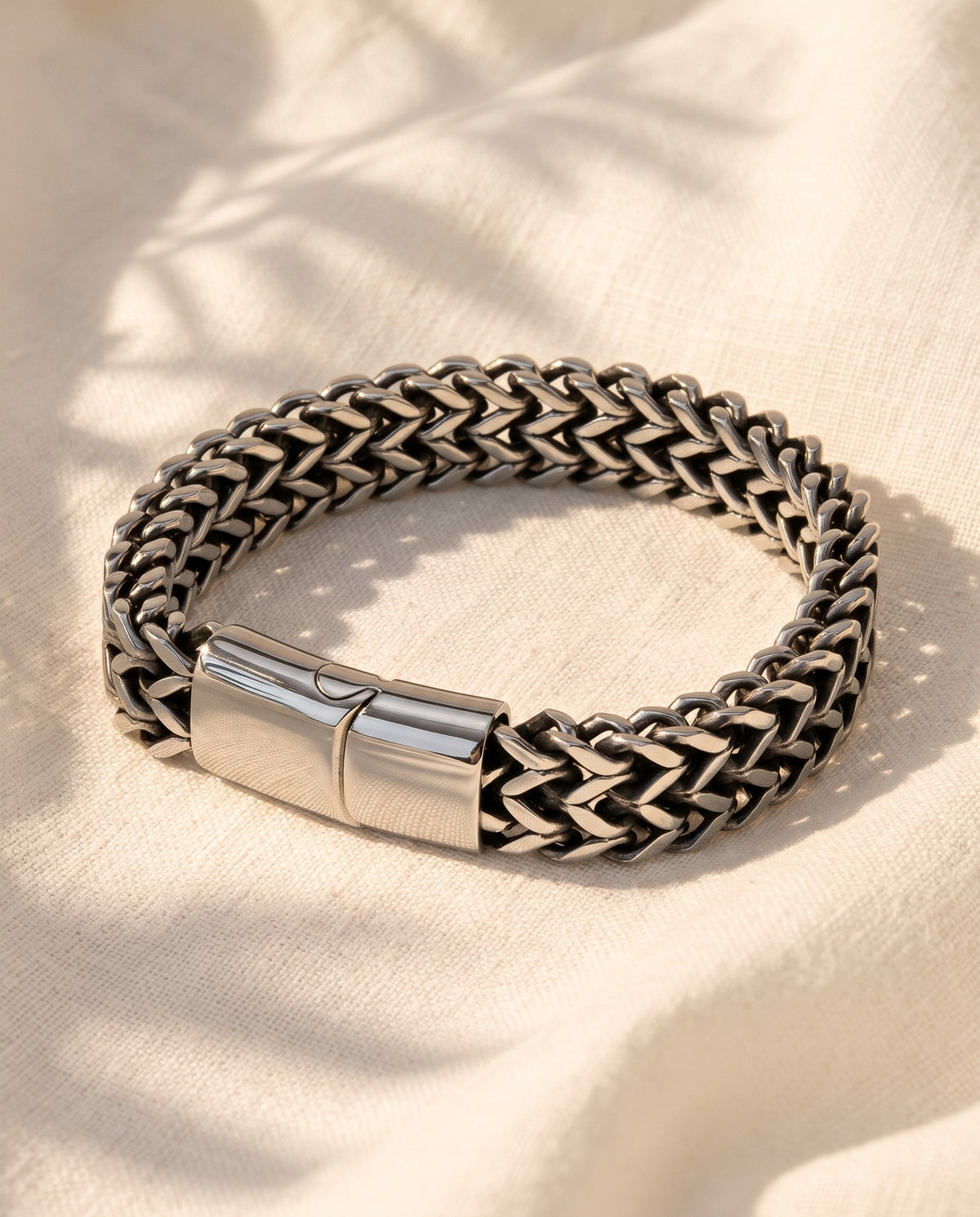 Marco Maveri Double Wheat Link Bracelet laid on cream linen, Silver