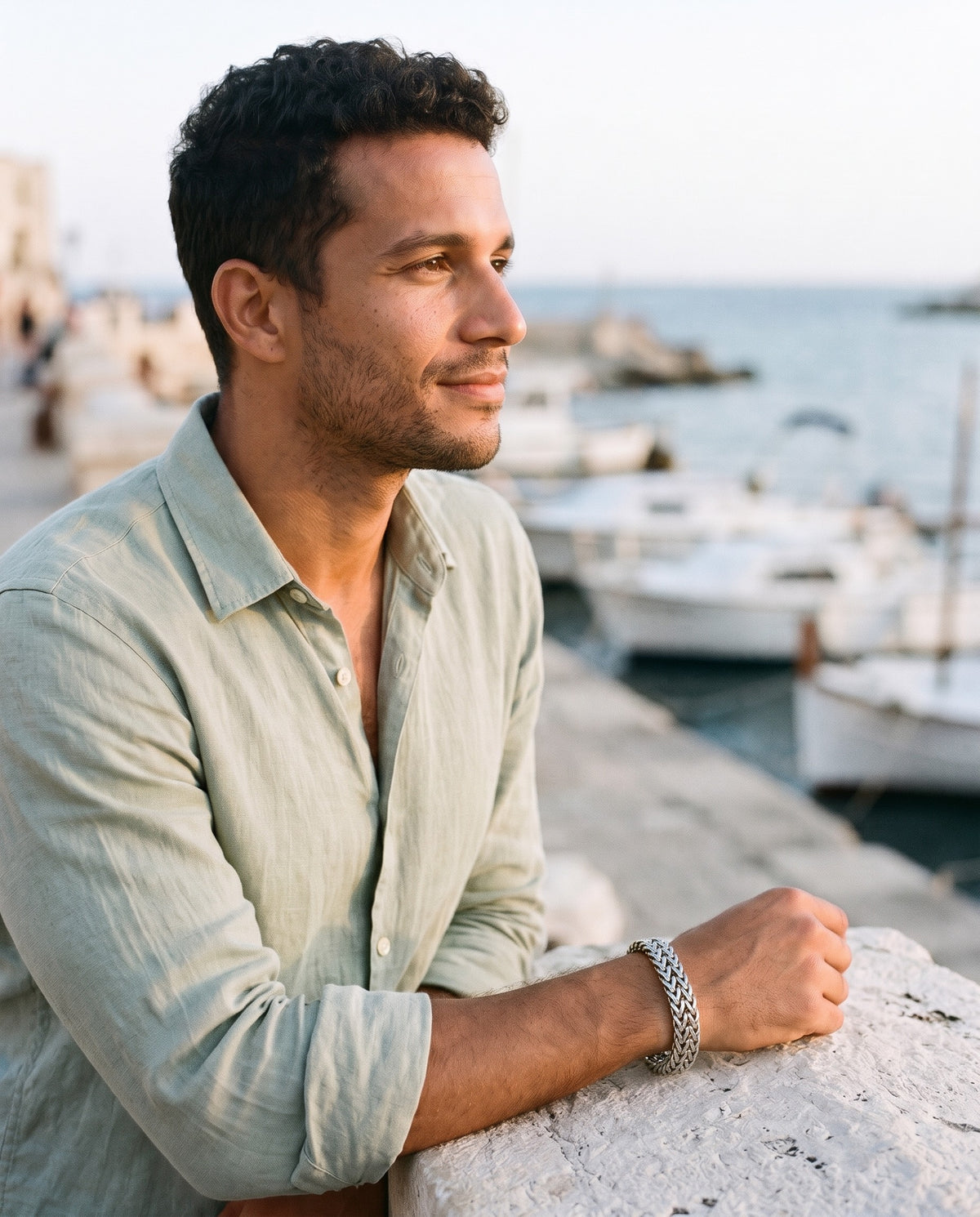 Man wearing the Marco Maveri Double Wheat Link Bracelet by the sea, Silver
