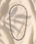 Marco Maveri Figaro Chain Necklace in Stainless Steel laid on cream linen, Silver