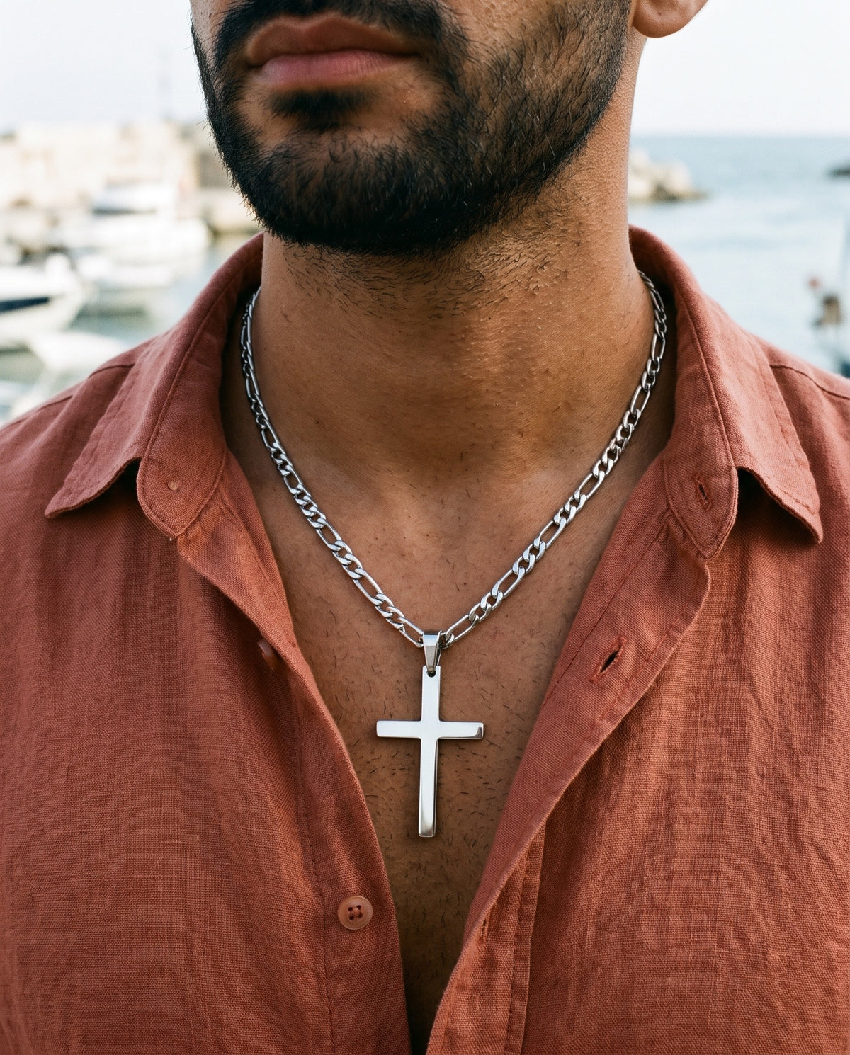 Marco Maveri Figaro Chain with Cross Pendant worn with a linen shirt, close-up, Silver