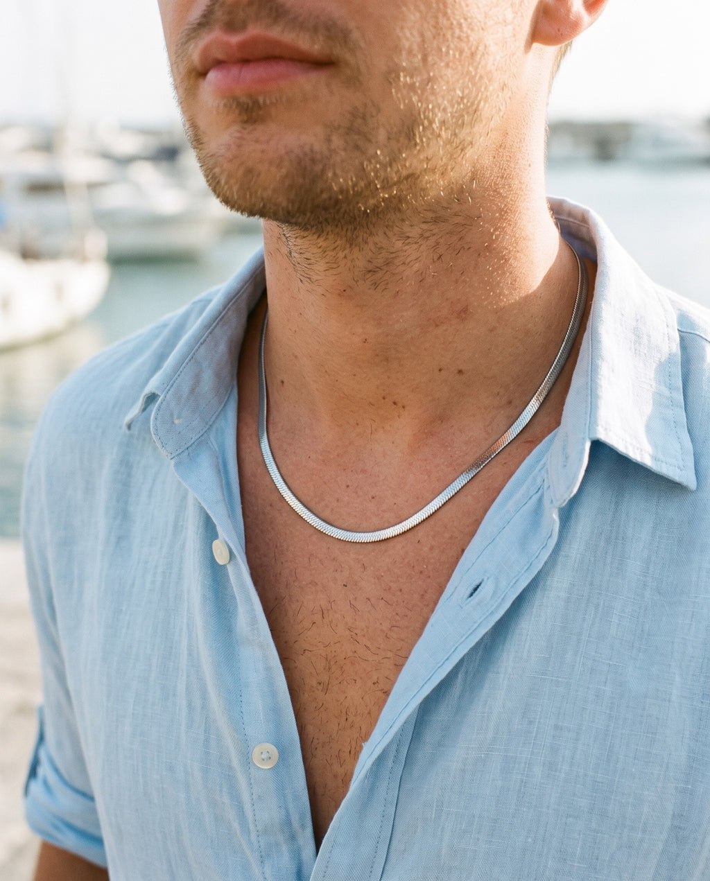 Marco Maveri Flat Snake Chain Necklace worn with a linen shirt, close-up, Silver