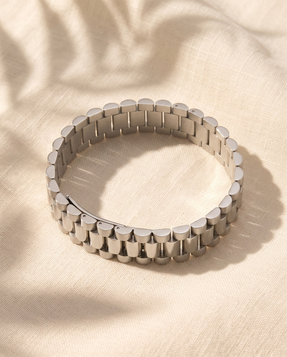Marco Maveri Geometric Link Bracelet in Titanium Steel laid on cream linen, Silver