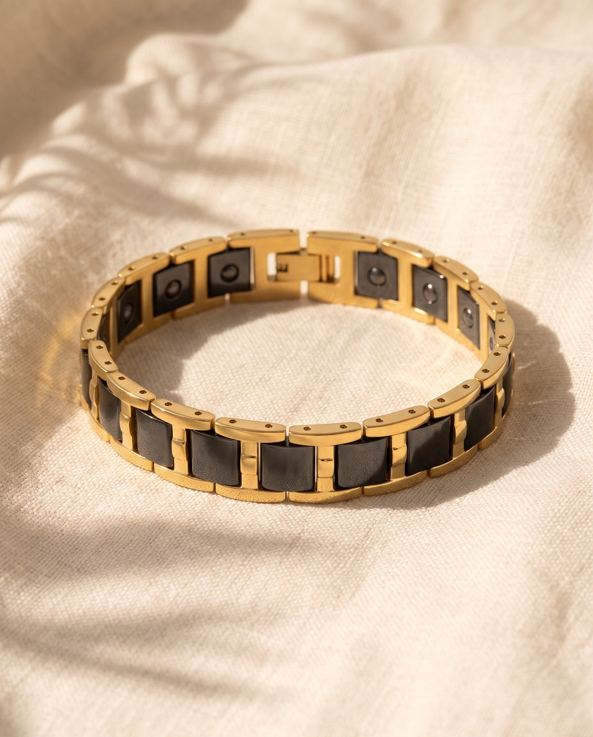 Marco Maveri Geometric Link Bracelet with Ceramic Inlay laid on cream linen, Black / Gold