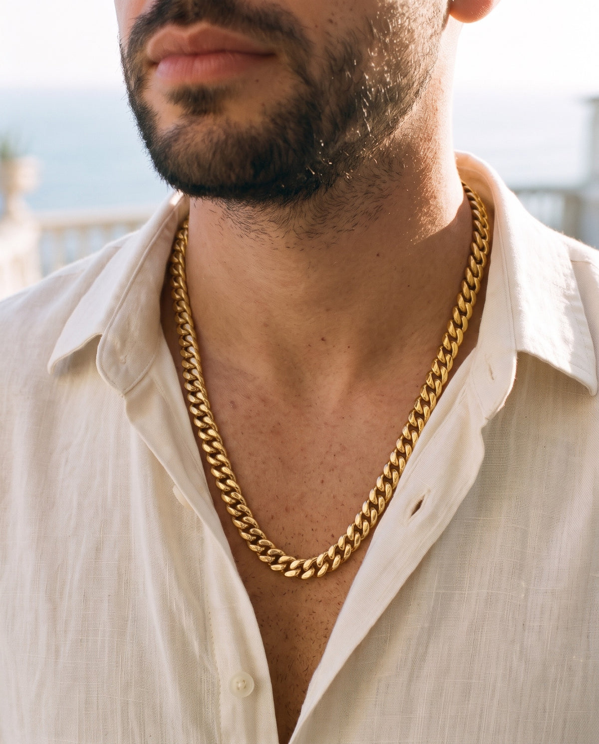 Marco Maveri Gold-Tone Cuban Link Chain worn with a linen shirt, close-up, Gold