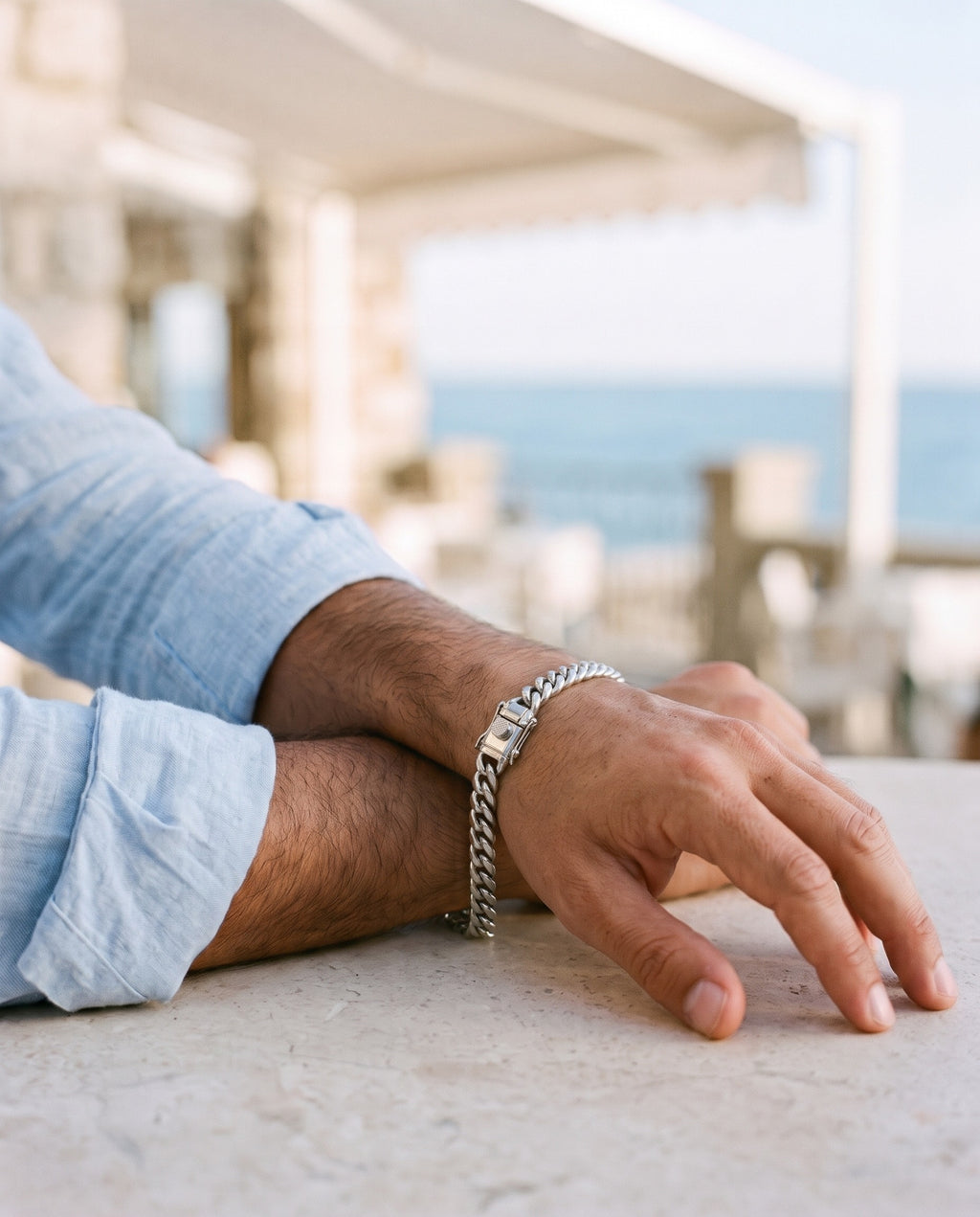 Marco Maveri Heavy Curb Chain Bracelet worn with a linen shirt, close-up, Silver