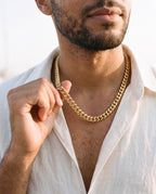 Man adjusting the Marco Maveri Heavy Curb Chain Necklace, close-up, Gold