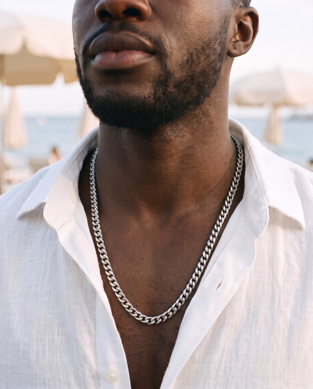 Marco Maveri Heavy Curb Chain Necklace worn with a linen shirt, close-up, Silver
