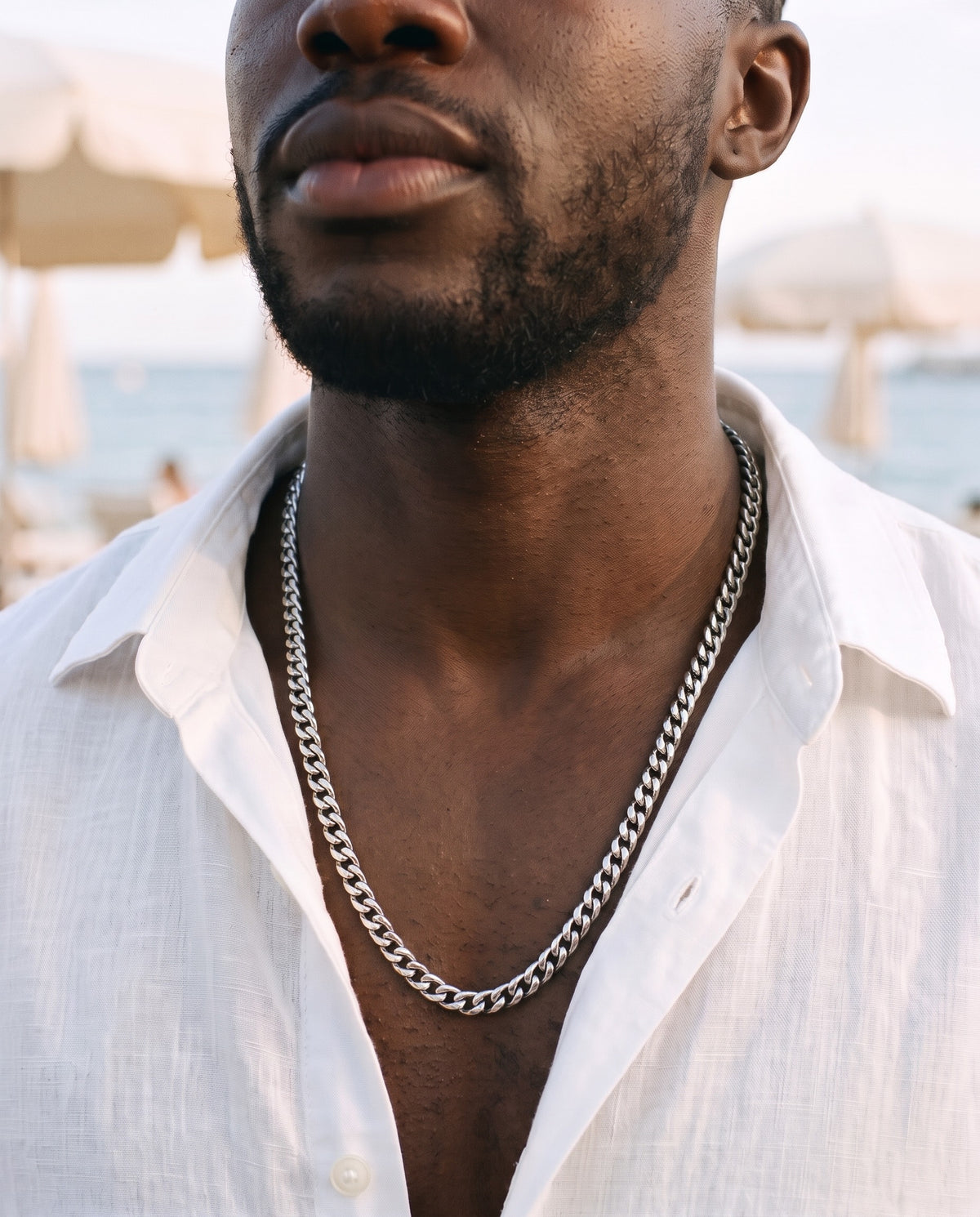 Marco Maveri Heavy Curb Chain Necklace worn with a linen shirt, close-up, Silver