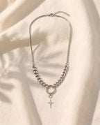 Marco Maveri Mixed Chain with Four-Point Star Pendant laid on cream linen, Silver