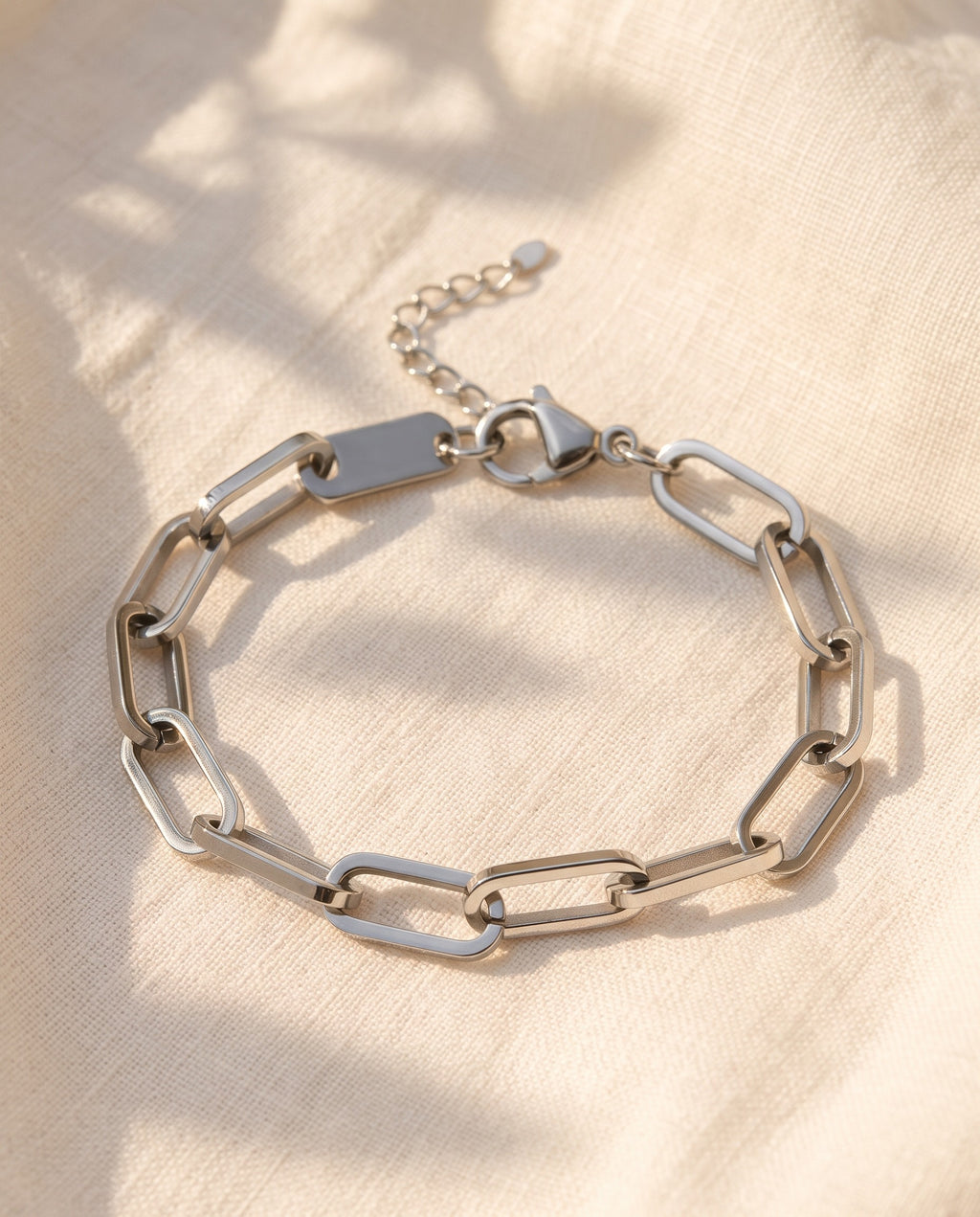 Marco Maveri Paperclip Link Bracelet laid on cream linen, Silver