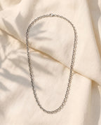 Marco Maveri Polished Cable Link Chain Necklace laid on cream linen, Silver