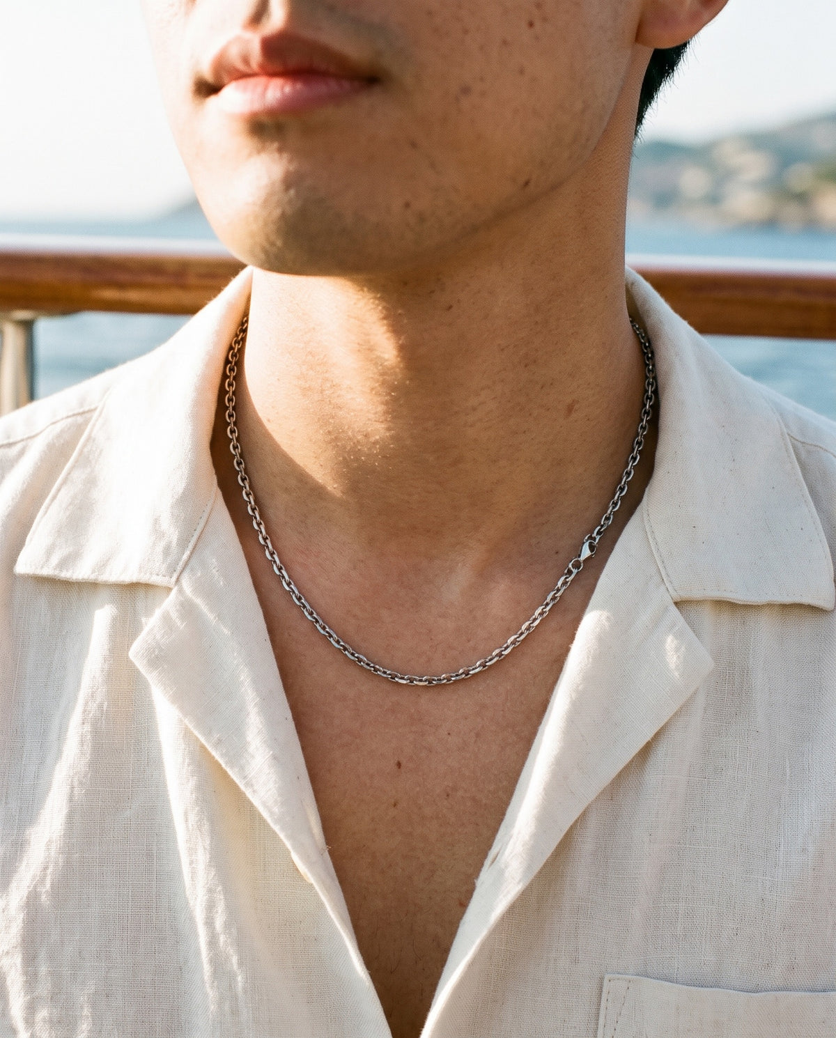 Marco Maveri Polished Cable Link Chain Necklace worn with a linen shirt, close-up, Silver