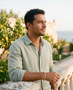 Man wearing the Marco Maveri Rope Chain Bracelet in Stainless Steel by the sea, Gold