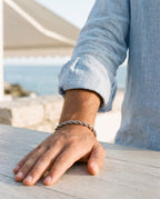 Marco Maveri Rope Chain Bracelet in Stainless Steel worn with a linen shirt, close-up, Silver