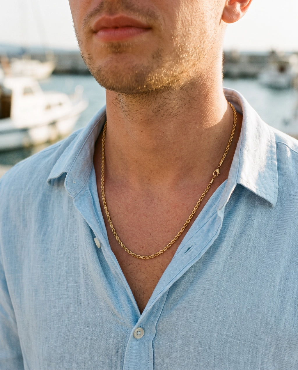 Marco Maveri Rope Chain in Gold-Tone Titanium Steel worn with a linen shirt, close-up, Gold