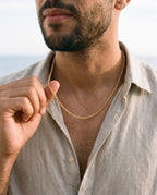 Man adjusting the Marco Maveri Rope Chain in Gold-Tone Titanium Steel, close-up, Gold