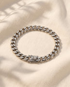 Marco Maveri Silver Cuban Link Bracelet laid on cream linen, Silver