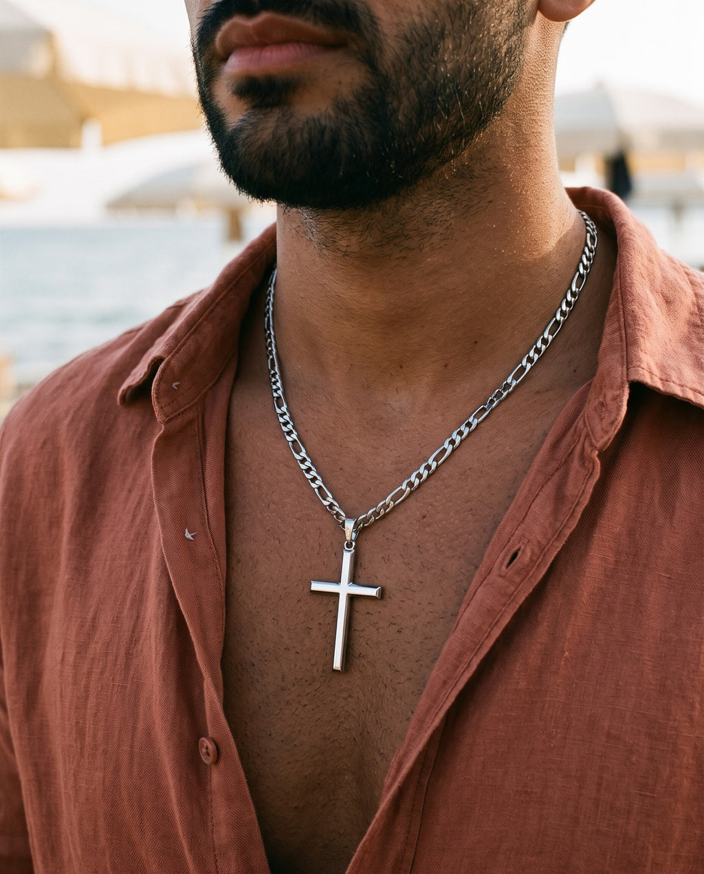 Marco Maveri Slim Cross Pendant Necklace worn with a linen shirt, close-up, Silver