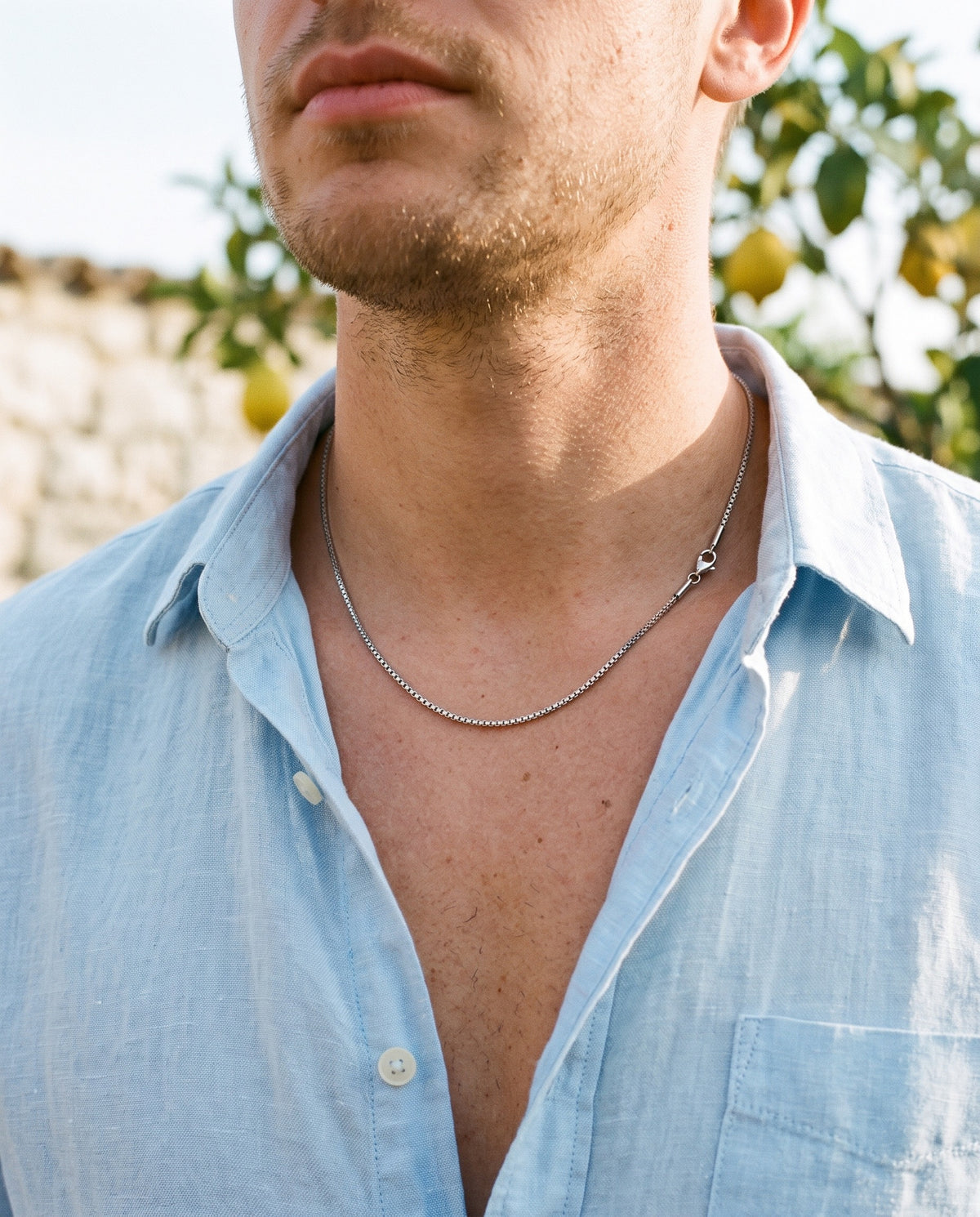 Marco Maveri Stainless Steel Box Chain Necklace worn with a linen shirt, close-up, Silver