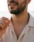 Man adjusting the Marco Maveri Stainless Steel Box Chain Necklace, close-up, Silver