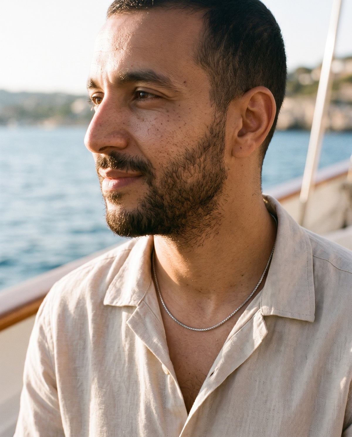 Man wearing the Marco Maveri Stainless Steel Box Chain Necklace by the sea, Silver