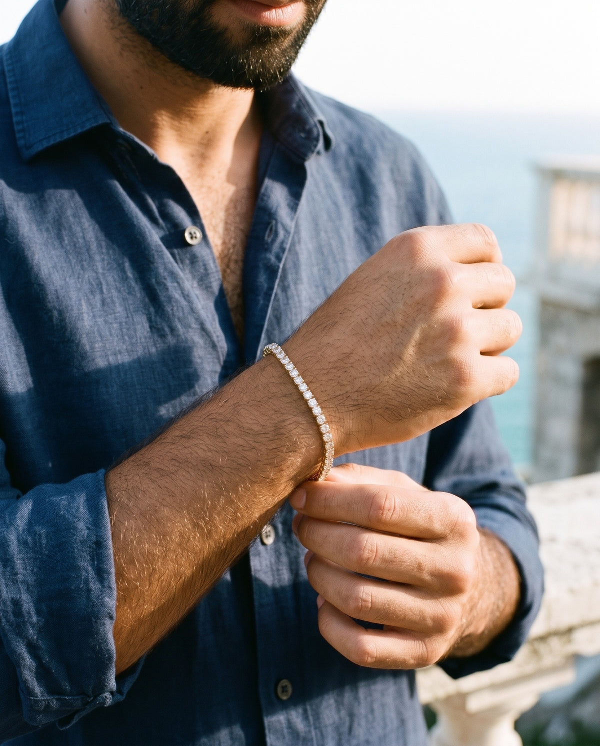 Man adjusting the Marco Maveri Tennis Bracelet with Cubic Zirconia, close-up, Gold